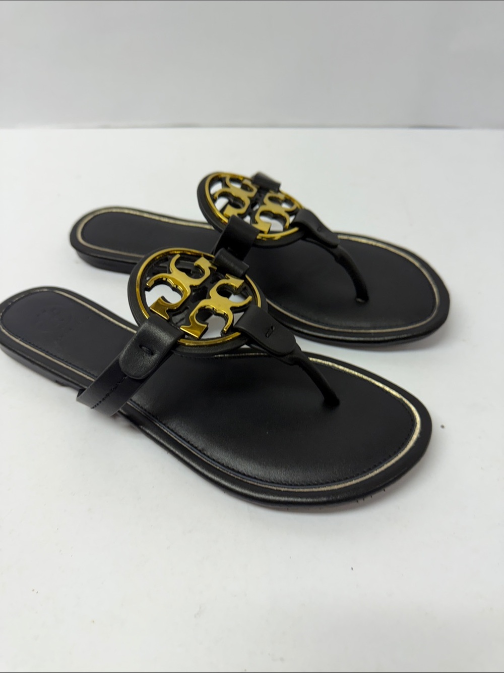 Gently used Tory Burch Flipflops / sandals black and gold women’s 42